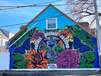 Reflect, Protect, Restore mural by Extinction Rebellion